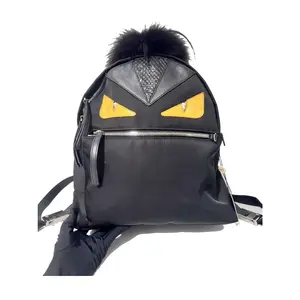 Pre-owned FENDI Nylon with leather and fur trim Backpacks Backpack Mini Black with yellow eyes and black fur Very Good S014260506072