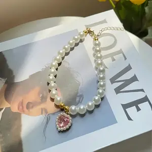 Adjustable Vintage Pearl Pet Necklace with Golden Heart Pendant And Bow Charm - Elegant Wedding Accessory for Dogs And Cats, Holiday Gift, White Pearls, Fashionable Design for Special Occasions, Pearl Necklace