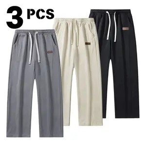 Men's solid color straight-leg sweatpants with an elastic drawstring and slant pockets, suitable for spring and autumn wear