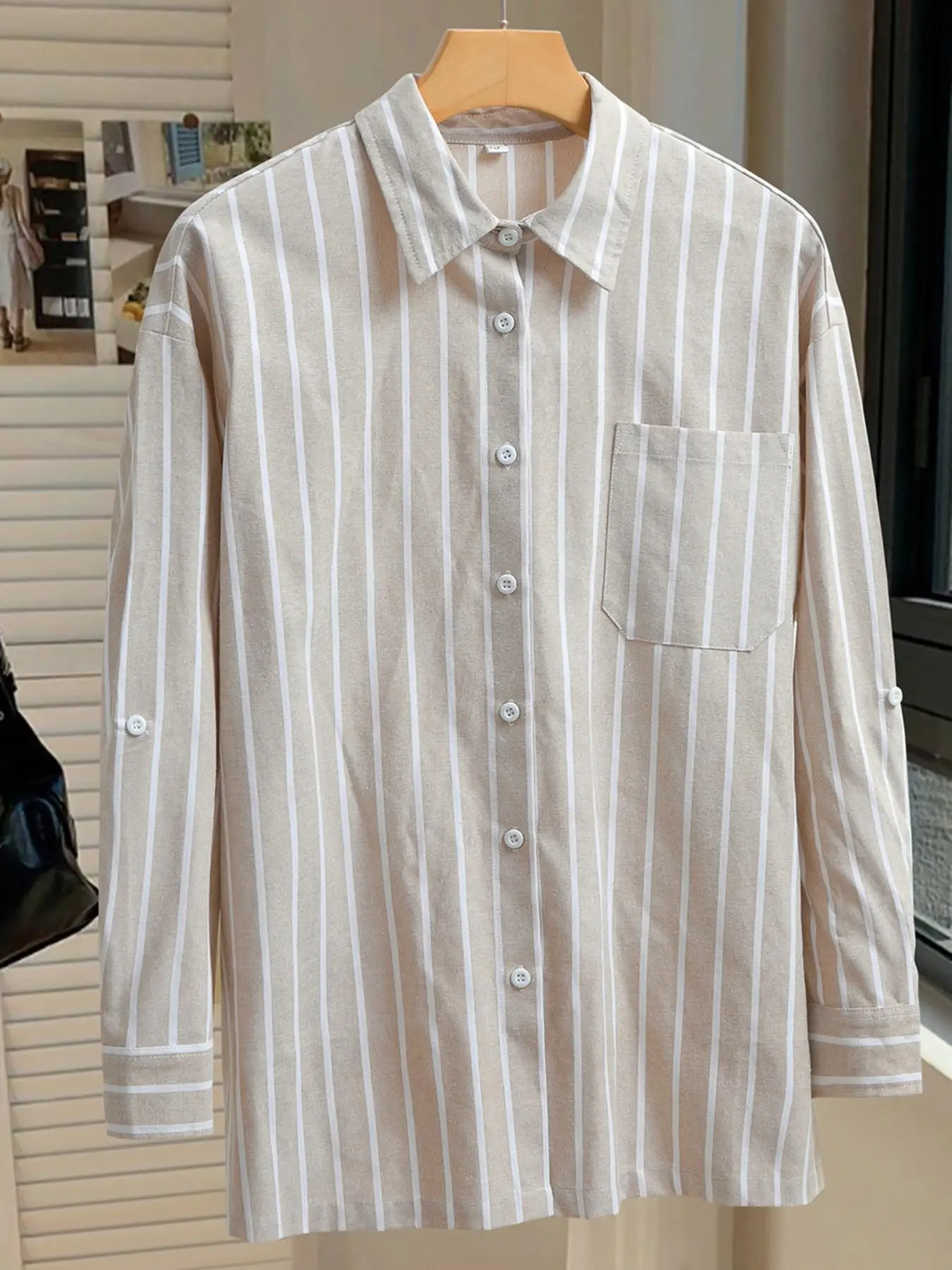 This trendy women's grey-green striped Collared button-down shirt is a loose-fitting, comfortable long-sleeved top. A versatile unisex piece, it's perfect for Casual street style or dates