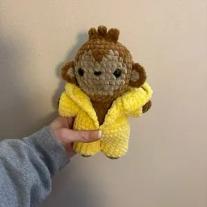 Hand crocheted monkey in a onesie