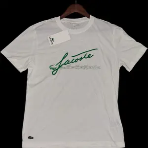 Lacoste Men's White T-Shirt with Green Script Logo and Lacoste Branding