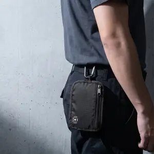 RFID-blocking wallet bag for travel, lightweight design with clip, securely stores cash, credit cards, and ID cards, unisex accessory