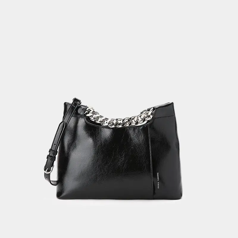 Oiled leather textured clutch bag with thick metal chain strap.