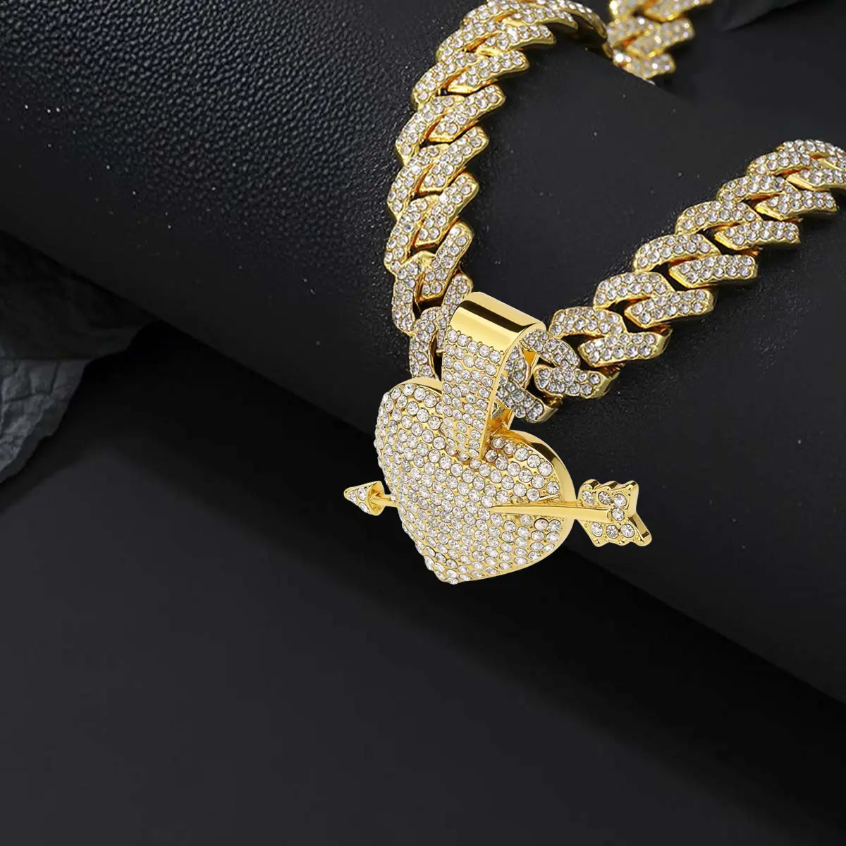 Unisex diamond encrusted heart shaped pendant necklace sparkling diamond encrusted Cuban necklace a stylish accessory in the style of hip hop rock and rap artists