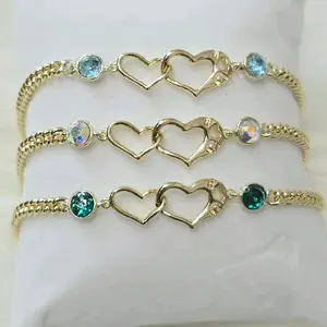 Pulsera de 2 corazones lisos entrelazados  y dos  cristales a los lados 6.5 + extensión 8 inch Laminado de alta calidad