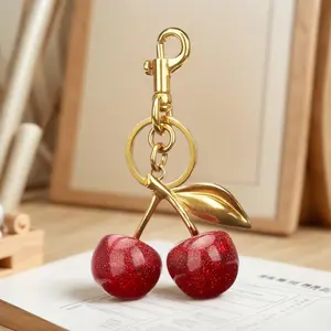 Cute Cherry Design Keychain for Women and Girls. Made of trendy alloy, it's a fashionable, all - match, and exquisite piece. Perfect as a birthday gift