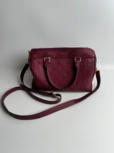 Pre-owned Louis Vuitton leather top handle bags Monogram Empreinte Speedy Bandoulière 25 Handbag in Bordeaux XP01696