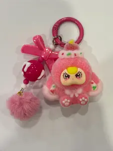 A cute pendant featuring a multi-colored plush doll, paired with a bow and pom-pom, Fuzzy keychain, Cute keychain accessory, suitable for hanging on bags or keys, adding a girlish atmosphere to everyday outings