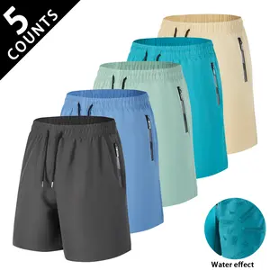 Mens 5 Pack Shorts with Magic Water Activated Print Design Featuring Hidden Coastal Themed Graphics That Reveal When Wet Ultra Quick Dry Fabric with Secure Zipper Pockets Perfect for Beach Days Pool Trips and Summer Adventures