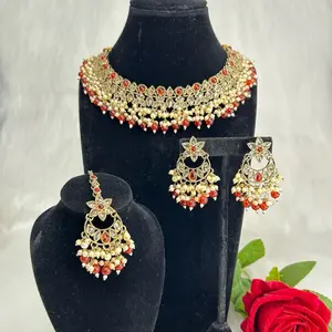 Beautiful Gold Tone Beaded Necklace With Gemstones Earrings And Tikka Set for Festive Wear