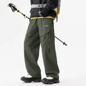 Men’s outdoor functional cargo pants for spring/summer and all seasons, featuring multiple pockets and 3D cutting, windproof and waterproof softshell pants with wide legs in a mountain style for hiking and climbing—fashionable menswear.