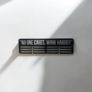 “No one cares. Work Harder” metal hanger