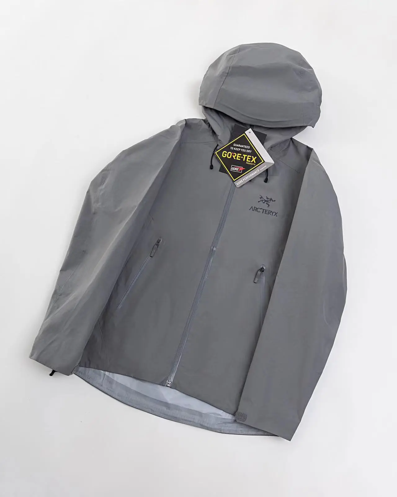 On‑Body Shot Of Men Windproof Waterproof Hooded Outer Coat Practical Zipper Pockets Designed For Outdoor Sports Travel Camping And City Daily Wear