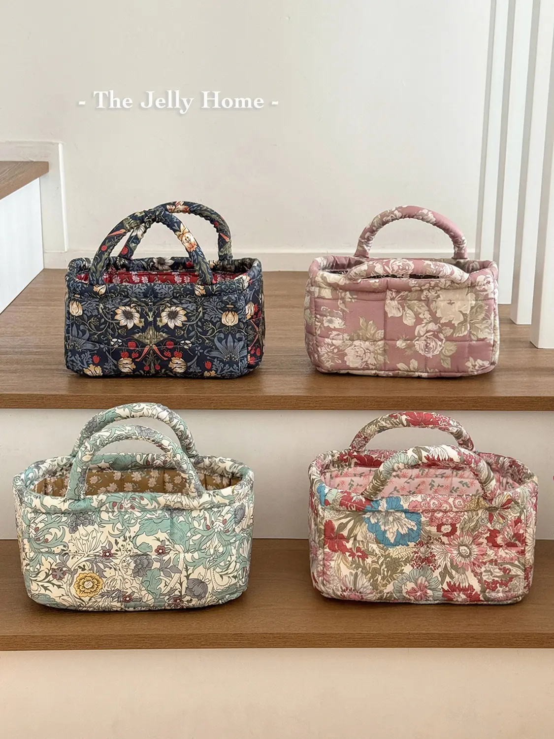 Small quilted storage basket with large floral pattern, vintage floral design, wear-resistant molded construction, handheld desktop design, portable—ideal for storing small miscellaneous items.