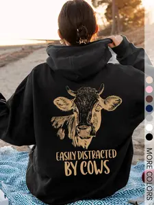 Women's Black Hoodie, Sweatshirts with "Easily Distracted by Cows" Humorous Print and Cow Graphic, Soft Fleece Fitted Pullover for Animal Lovers and Casual Outdoor Wear, Long Sleeves
