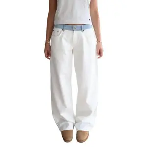 Women’s white jeans with a blue striped waistband featuring side poppers; straight cigarette-cut legs, loose and comfortable. Suitable for wearing over a raincoat.