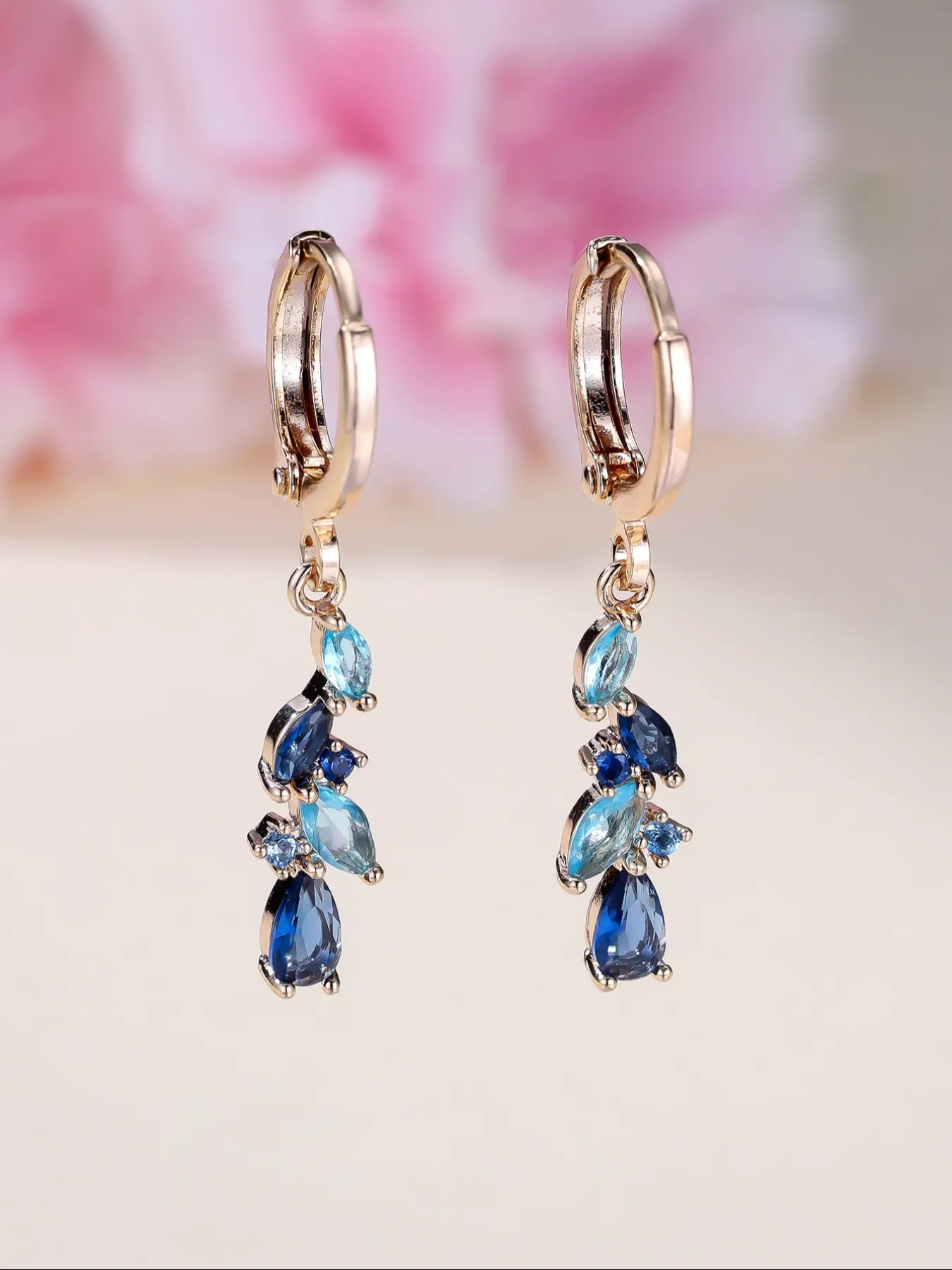 Fashionable, stylish sapphire blue teardrop cubic zirconia gold-coloured ladies' earrings. Classic, versatile jewellery designed especially for women. Party accessories. Birthday gifts. High Quality Earrings