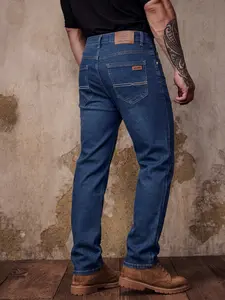 Men's Blue Slim Fit Mid Straight Denim Jeans, all-season basic style. Features the classic five-pocket design with a leather patch, creating a versatile piece suitable for both urban casual and smart-casual commutes.