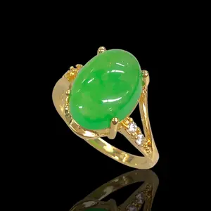 Gold Oro Laminado World Fortune Jade Ring with Green Gemstone and Decorative Accents