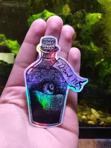 Drink Me Bottle Sticker – Holographic Alice in Wonderland Potion with Eyeball, Gothic Fantasy Vinyl Decal