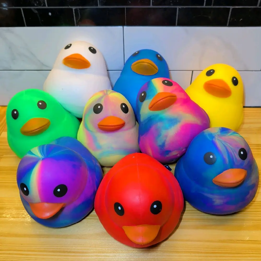 SUNNY DAYS!! SQUISHY DUCKS!! AGES 3+. EACH SOLD SEPARATELY. VARIETY OF COLORS!!