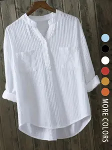 A women's white V-neck relaxed Loose Fit casual Button Up design blouse with Pockets that is versatile for both work and casual wear.