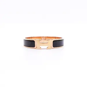 Pre-owned Hermes Clic H Black Gold Tone Metal PM Bracelet T10423413