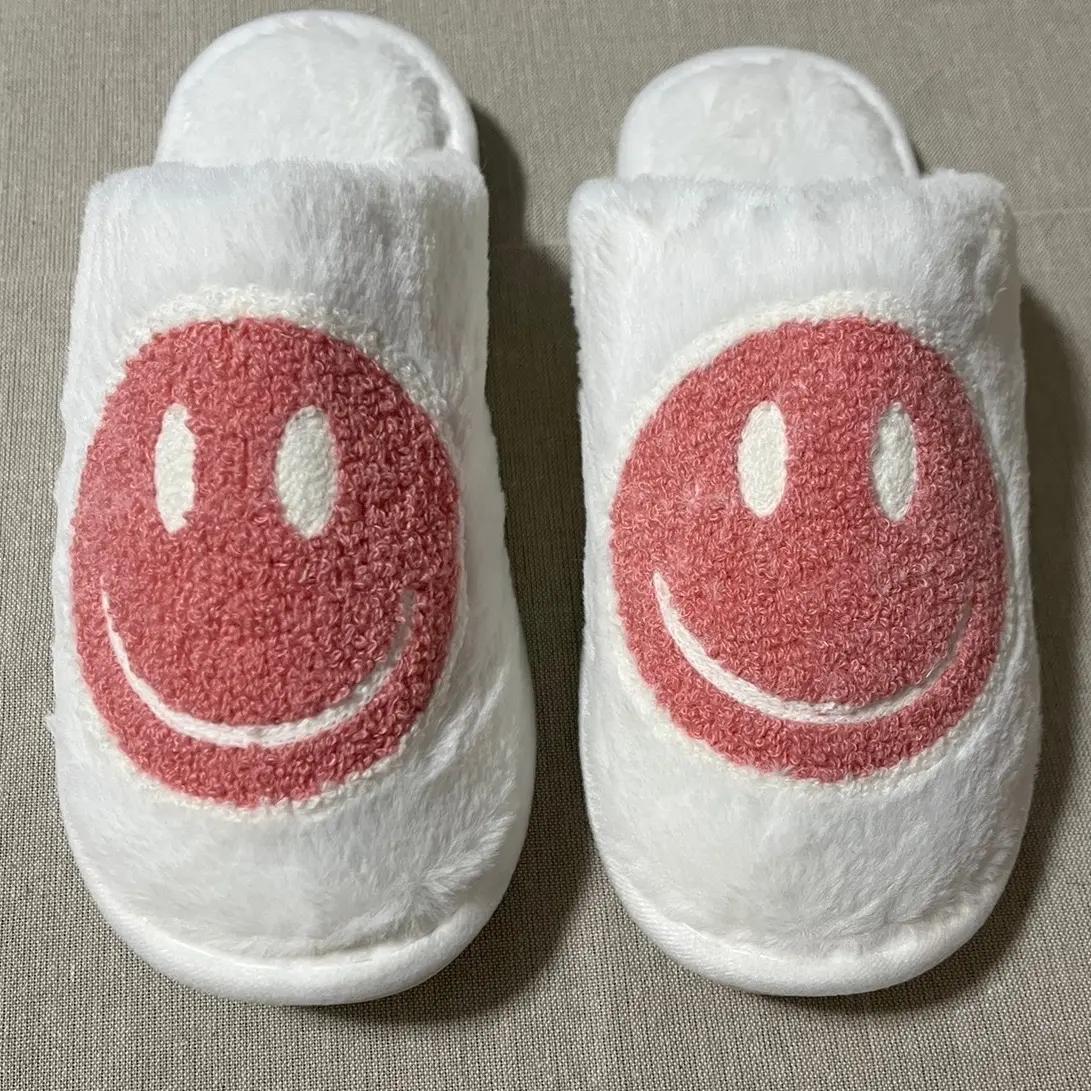 Size 7 fuzzy pink smiley slippers