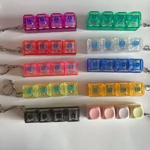 Glowing Keyboard Fidget Toy 4-in-1 Decompression Button Keychain Stress-Relief Finger Clicker in Transparent Color Variety Pack
