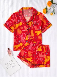 A two-piece women's pajamas set featuring a leopard animal print design, consisting of a short-sleeved shirt pajama top and elastic shorts, offering comfort and versatility. It is a must-have pajamas set for New Year gifts and Valentine's Day