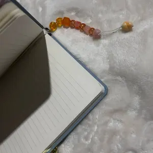 Orange Wearable Bookmark with Beaded Design for Stylish Page Marking