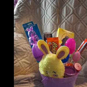 Easter gift basket with chocolate candy and toys