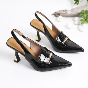 Black glossy leather high heels with pointed toe and back strap, thin heel design, suitable for women’s office and commuting.