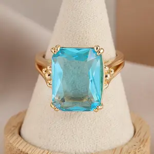 The Princess Square Diamond Ring with Sea Blue Zirconium Color High-Quality Fashionable Wedding Engagement Ring for Women Daily Wear or Gatherings Elegant Design Metal Coating