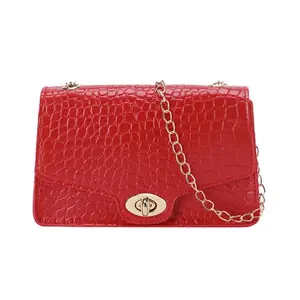 Red Crocodile Pattern Crossbody Bag with Gold Chain Strap and Secure Buckle Closure
