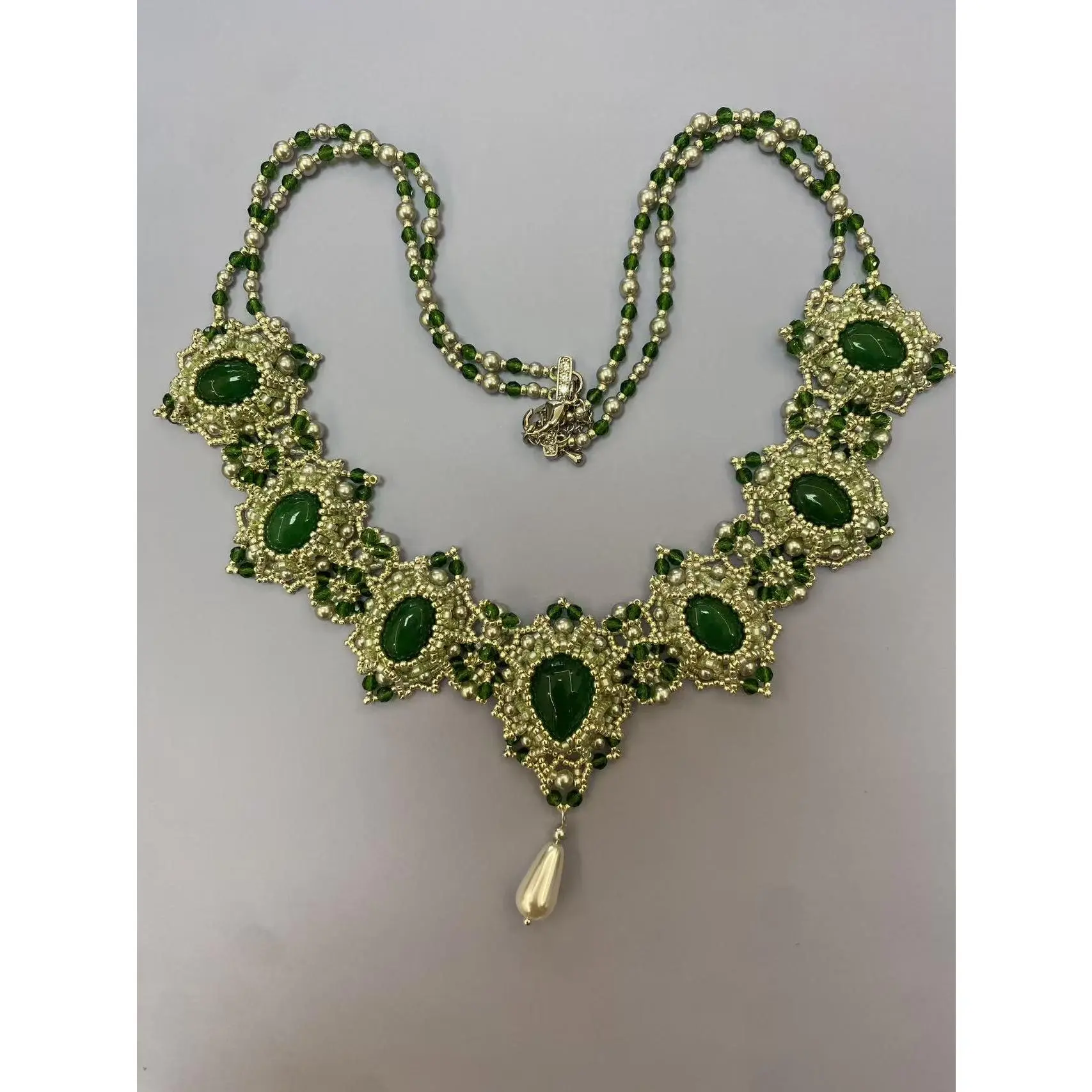 Elegant Green Emerald Necklace with Gold Accents and Pearl Pendant for Special Occasions