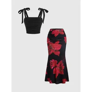 Women’s retro sweet-and-spicy two-piece set featuring a butterfly-print midriff top and a high-waisted mermaid skirt with a lily print; elegant slim fit, suitable for dates and parties. GARMENTARY