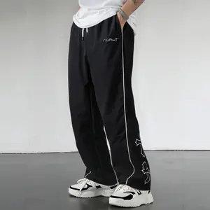 Men’s wide-leg pants with a cross print, lightweight streetwear track pants with side stripes, elastic waist drawstring casual pants for hip hop, Y2K, and everyday wear