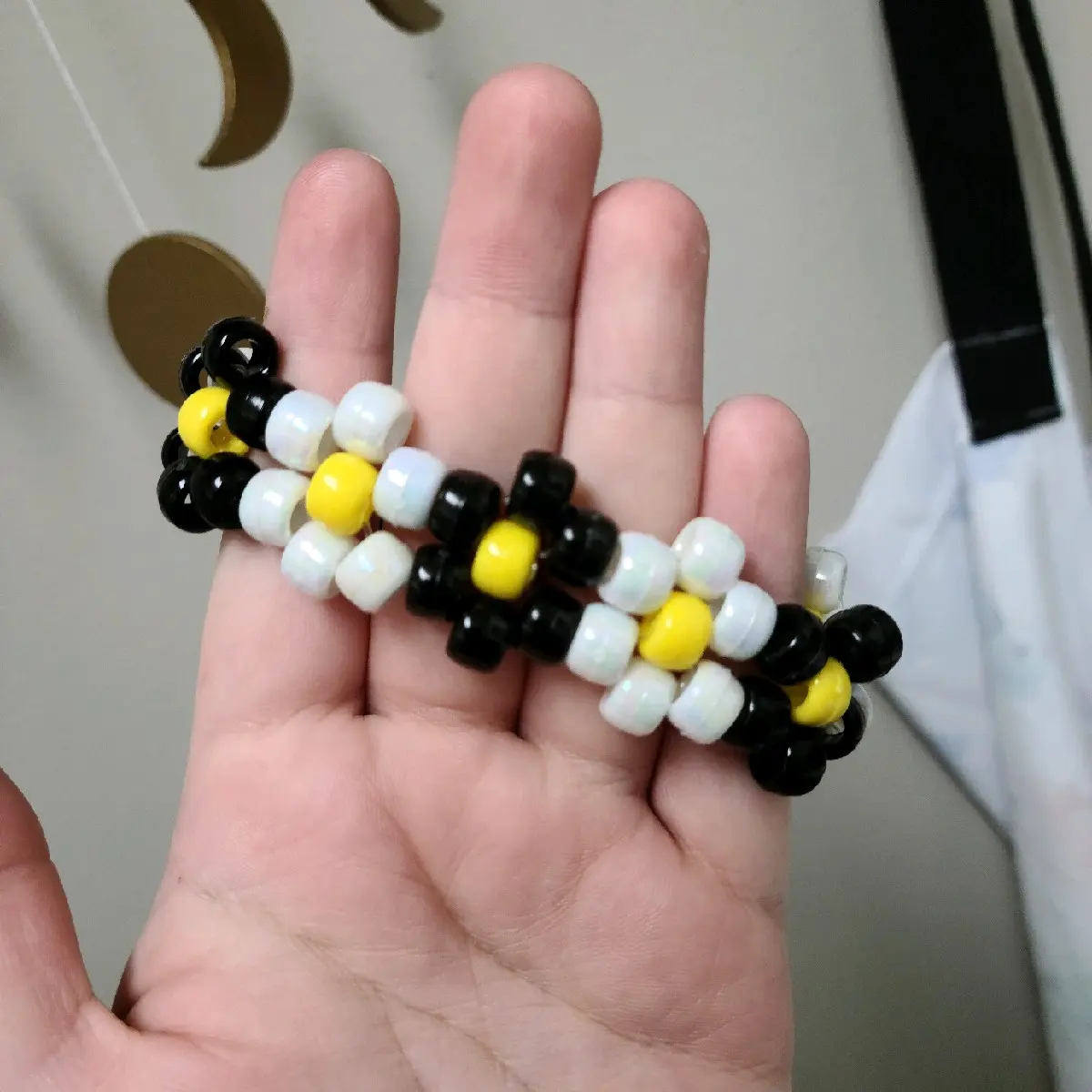 black and pearlescent flower kandi cuff