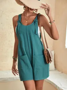 A women's solid color casual fashion sleeveless overalls with patch pockets, adjustable straps, and knot design, suitable for summer, daily outings, beach vacations, or weeend picnics.