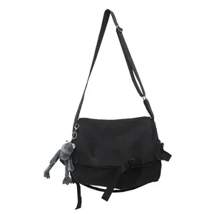Japanese workwear-style canvas crossbody bag with frog charm, large-capacity messenger bag, unisex design