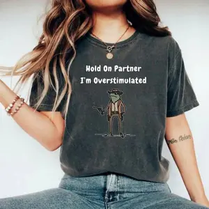 Hold On Partner I’m Overstimulated Tee, Cowboy Frog Graphic T-Shirt, Funny Meme Western Shirt, Viral Humor Outfit, Unisex Tee