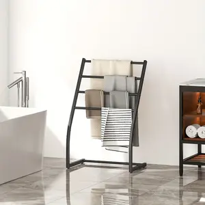 Four-layer towel drying rack with blanket storage function, free-standing design and sturdy metal structure, suitable for use in bathroom, bedroom or living room, towel rack