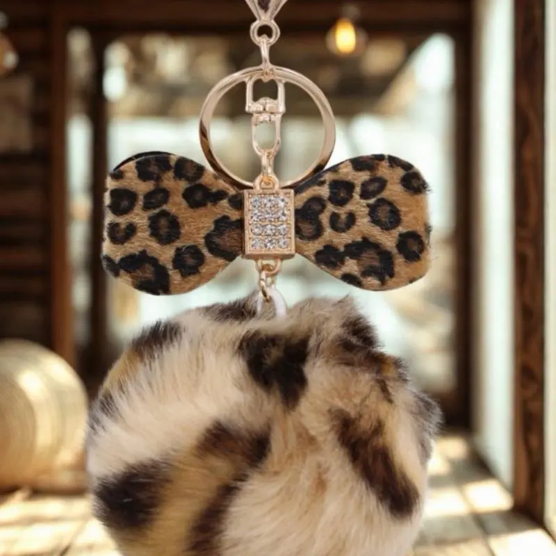 Women’s Durable Fashion PU Leather Keychain - Casual Everyday Bag Charm with Metal Bow Knot, Smooth Leather Accent, Leopard Print Fur Ball, Rhinestone Detail, Lightweight Metal Clasp (Note: Small Ball Presents Choking Hazard)