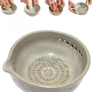 Handmade garlic grater X herb bowl, a two-in-one multi-functional kitchen tool with 5 different hole diameters, an herb peeling bowl suitable for grating garlic and ginger, making kitchen preparation easy and tidy without any clutter. Kitchen utensils