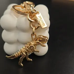 {Keychain} Fashionable and Personalized Light Gold Dinosaur Pendant Keychain - Simple Skeleton Dinosaur Design Men's and Women's Keychains