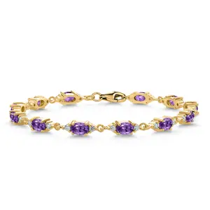 Gem Stone King 18K Yellow Gold Plated Silver Purple Amethyst and White Moissanite Tennis Bracelet For Women (6.31 Cttw, Gemstone Birthstone, Oval 6X4MM, 6.5, 7, 7.5 Inch)