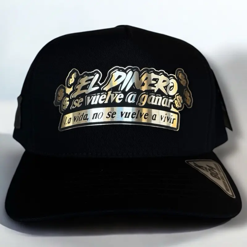 Unisex Adjustable Flat Bill Snapback Trucker Baseball Cap - Gold Plate, Spanish Text Print, Graphic Details, Get Money Motif, "Hat the Money is Earned Again" Slogan, Metallic, Hip Hop Drip, Humorous Message, Casual Outdoor Fashion Accessory