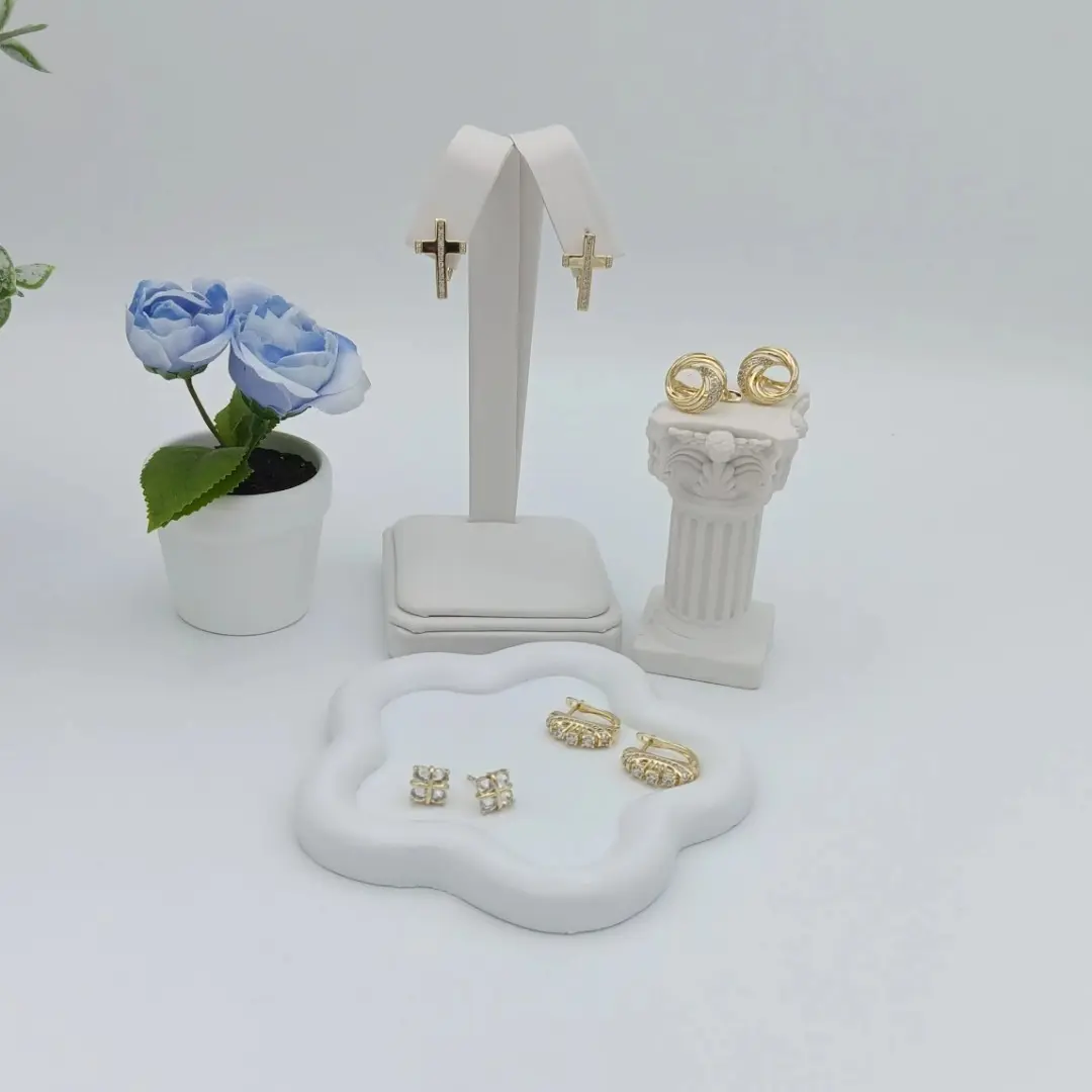 Various designs of 14k golden plated earrings. High quality